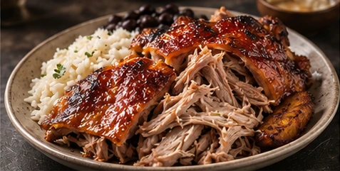 Slow-cooked pork with crisp skin, rice, black beans and plantains